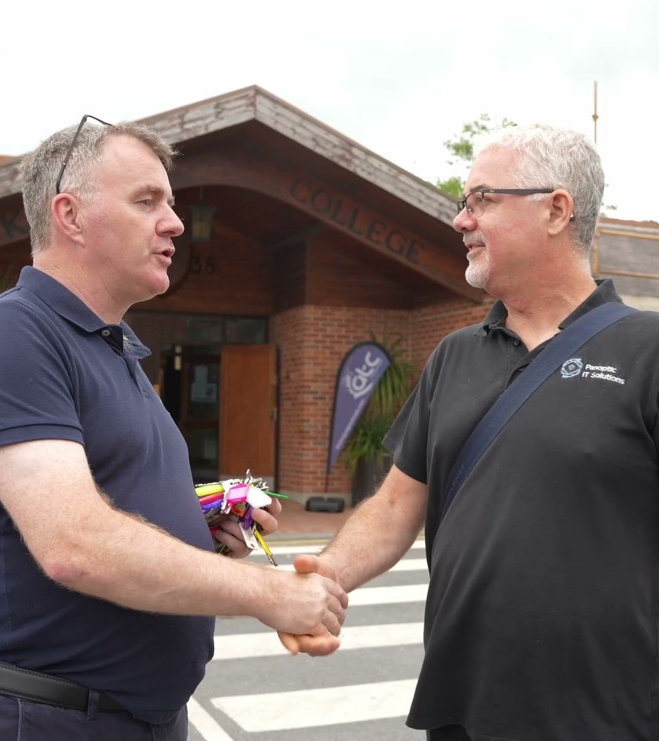 A Panoptic team member shaking hands with a client outside their premises
